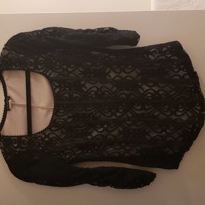 - Venus fitted black lace top, beige underneath..